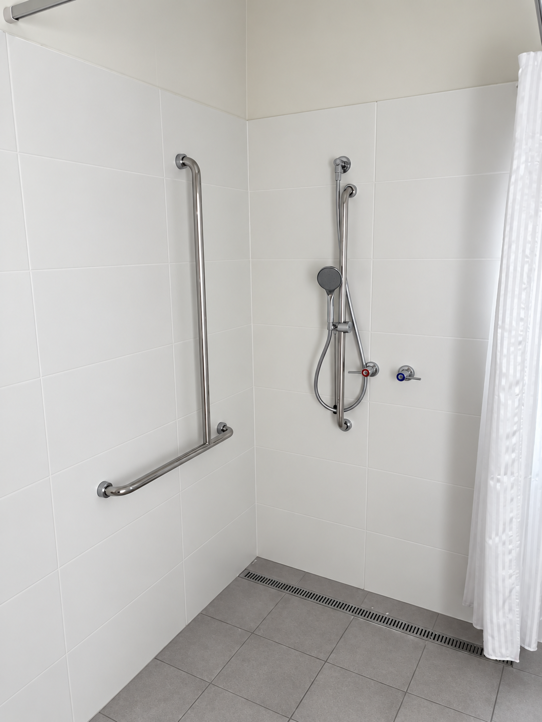 Bright Modern Accessible Shower Stall.png