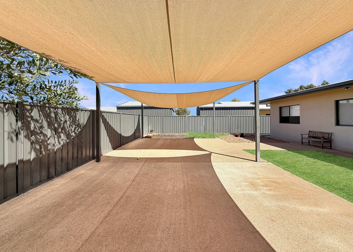 Shaded outdoor entertainment area. With concrete flooring.