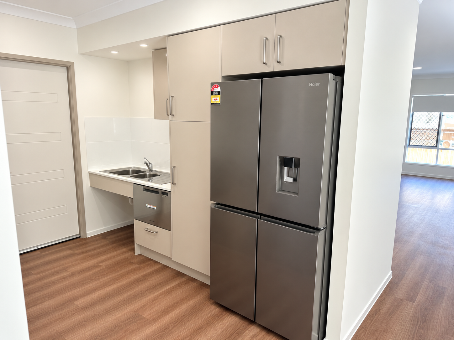Modern Galley Kitchen with Haier Refrigerator.png