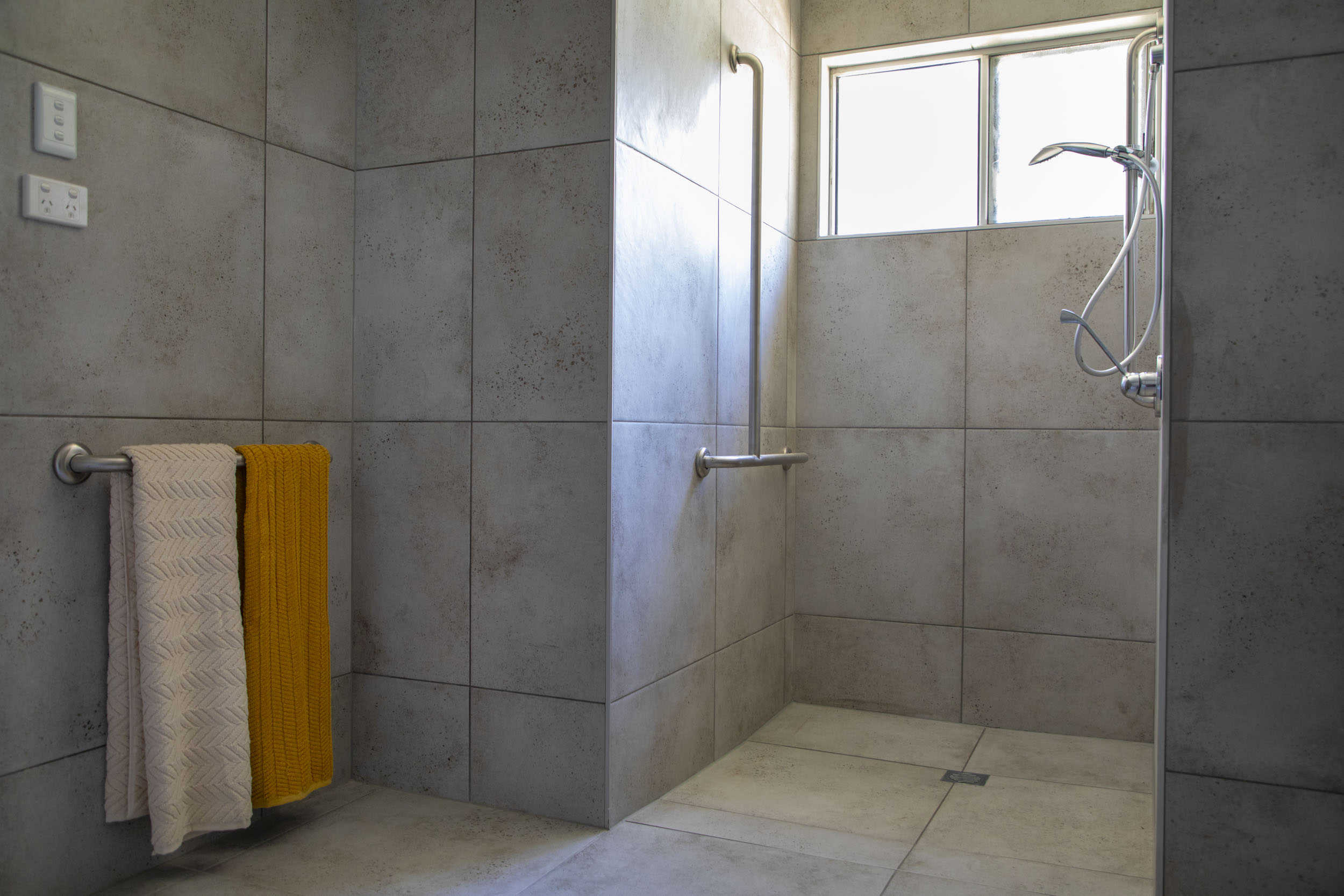 SDA pool area, highlighting an orange exterior feature wall.