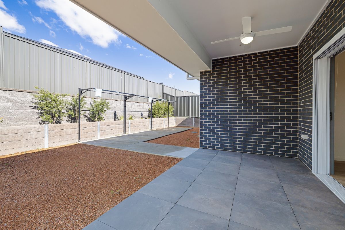Brand new 3-bedroom High Physical Support home in Wyee, featuring open-plan living, media room, and private outdoor space — Home image 8