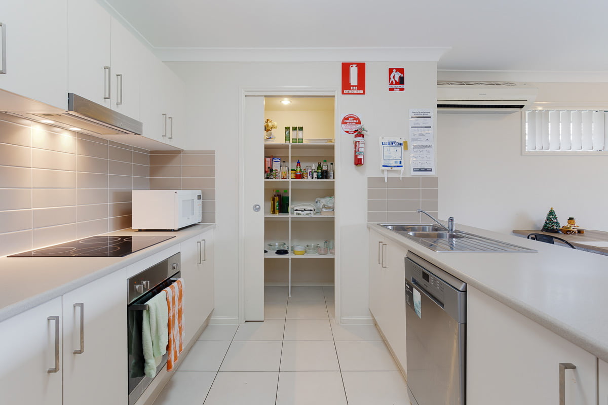 Enjoy living on a quiet residential street with a short drive to local shops. — Home image 3