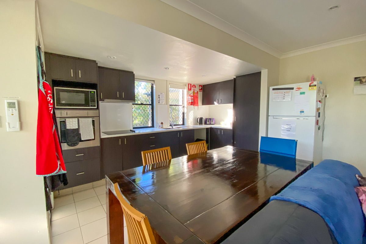Fully accessible ensuite bedroom with kitchenette and private patio, with close access to shops and amenities. — Home image 4
